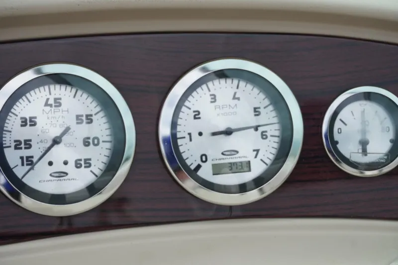 Slide: The Image of Dashboard gauges of a 2003 Chaparral 230 SSi boat, displaying speed and RPM. - 18