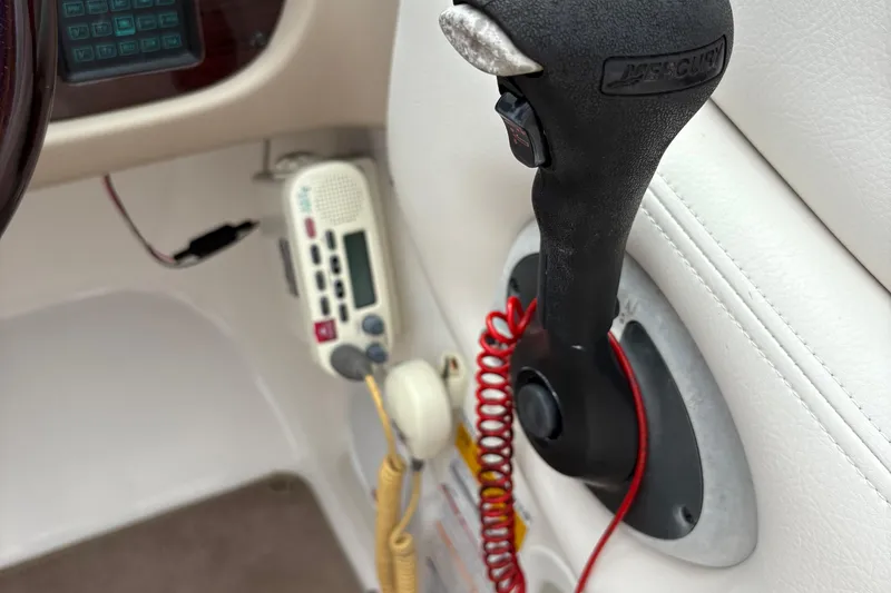 Slide: The Image of Close-up of 2003 Chaparral 230 SSi boat controls and radio equipment. - 21