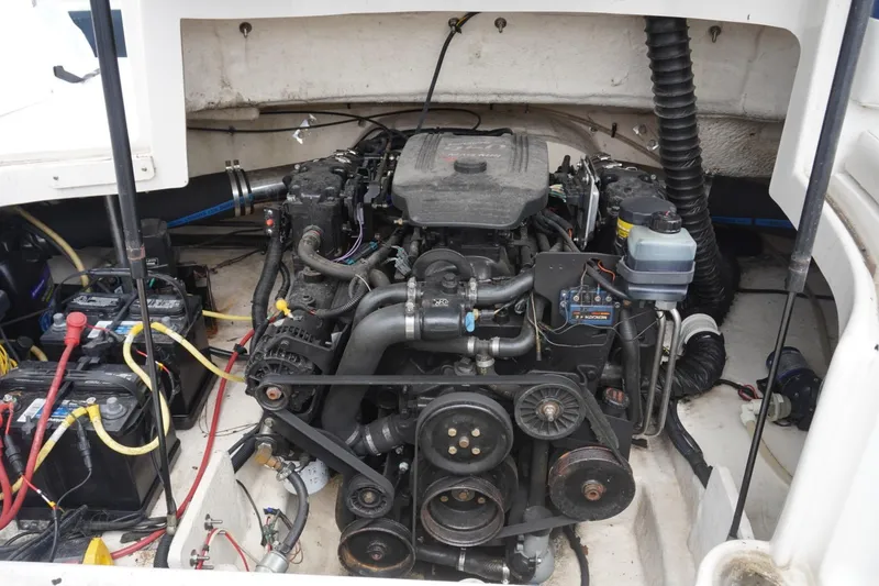 Slide: The Image of Engine compartment of a 2003 Chaparral 230 SSi boat, showing detailed mechanical components. - 27