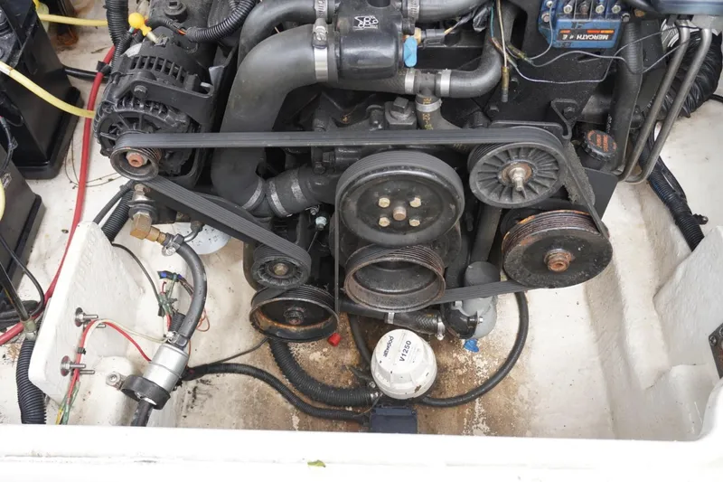 Slide: The Image of Engine compartment of a 2003 Chaparral 230 SSi boat, showing belts and components. - 29