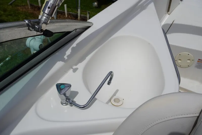 Slide: The Image of 2003 Chaparral 230 SSi boat interior with sink and faucet detail. - 40
