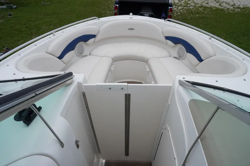 Slide: The Image of 2003 Chaparral 230 SSi boat interior with white seating and blue accents. - 44