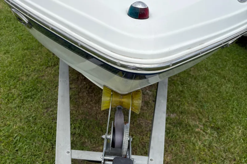 Slide: The Image of Bow of 2003 Chaparral 230 SSi boat on trailer, grassy background. - 52