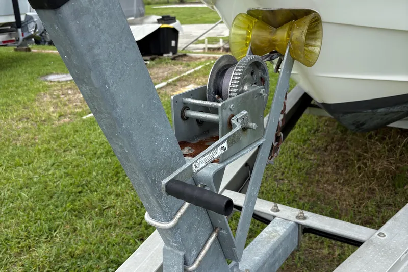 Slide: The Image of Trailer winch for 2003 Chaparral 230 SSi boat on grassy area. - 57