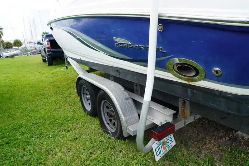 Slide: The Image of 2003 Chaparral 230 SSi boat on trailer, parked on grass, rear view. - 63