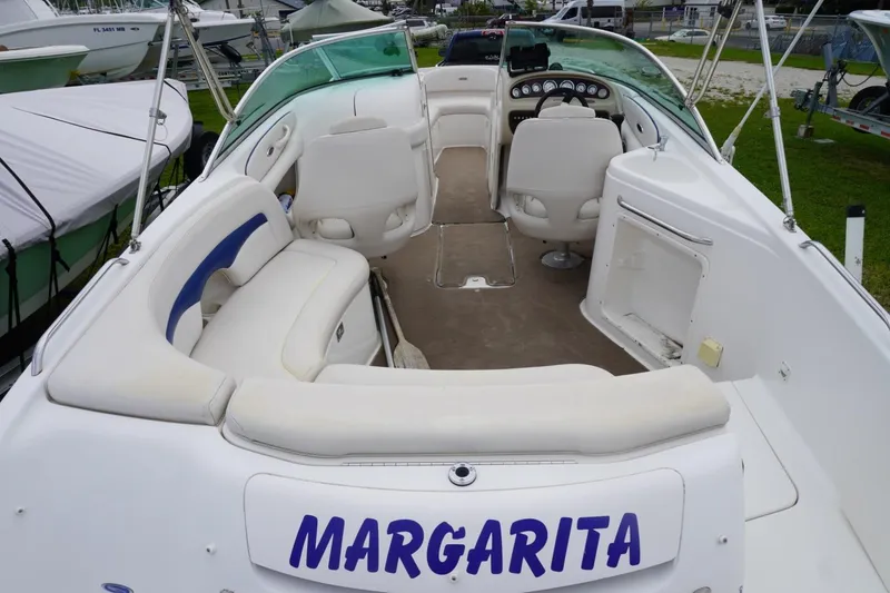 Slide: The Image of 2003 Chaparral 230 SSi boat interior with seating and steering console. - 9