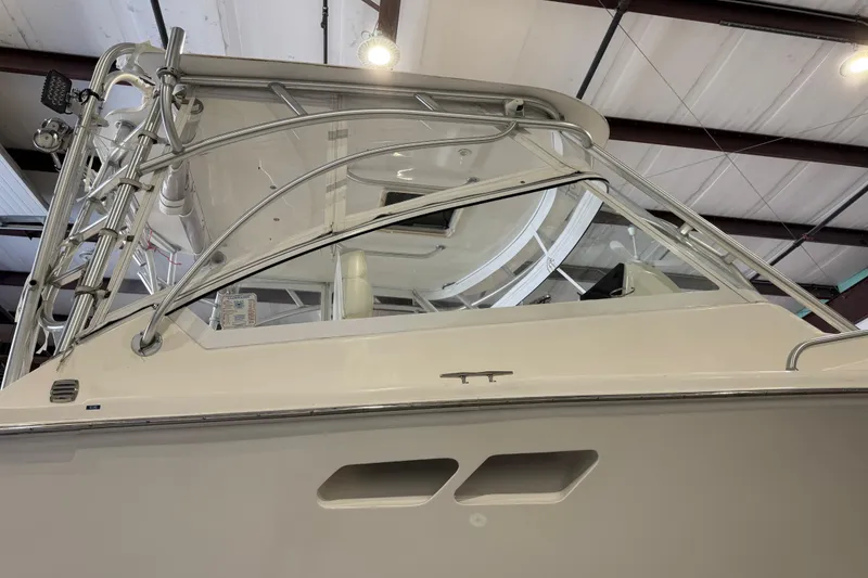 Slide: The Image of 2011 Luhrs 30 Open boat in indoor storage, showcasing sleek design and sturdy structure. - 10