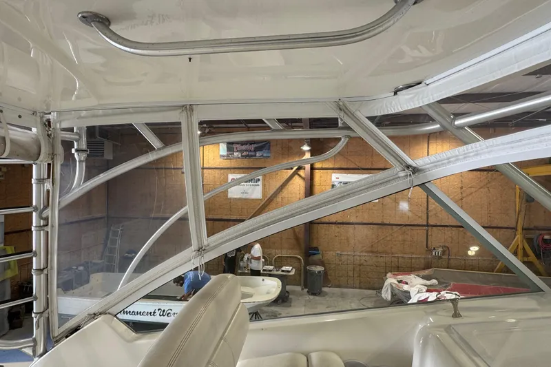 Slide: The Image of Interior view of a 2011 Luhrs 30 Open boat in a workshop setting. - 15