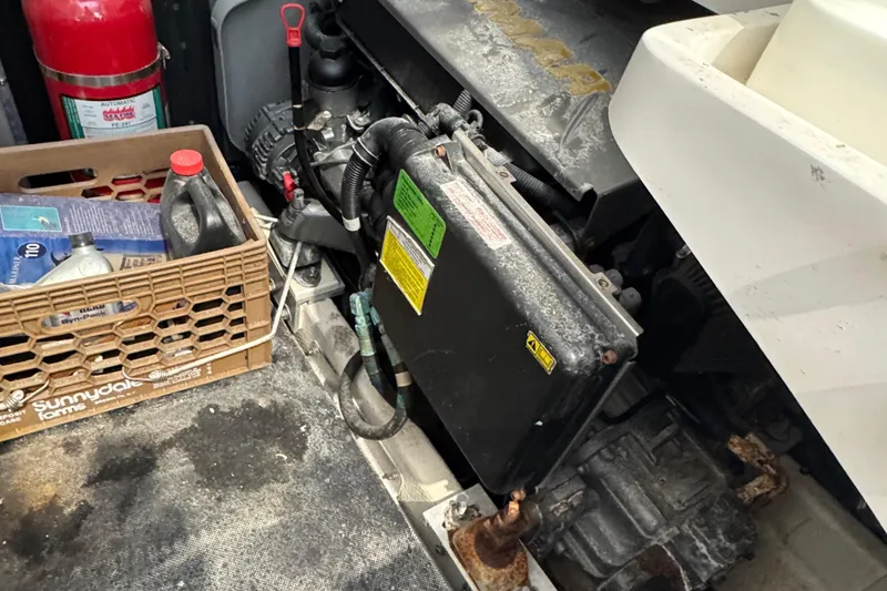 Slide: The Image of Engine compartment of a 2011 Luhrs 30 Open boat with maintenance supplies. - 22