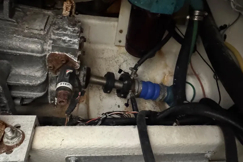 Slide: The Image of Engine compartment of a 2011 Luhrs 30 Open boat, showing mechanical components and wiring. - 23