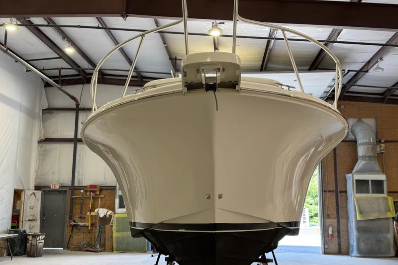 Slide: The Image of 2011 Luhrs 30 Open boat in a warehouse, viewed from the front. - 6