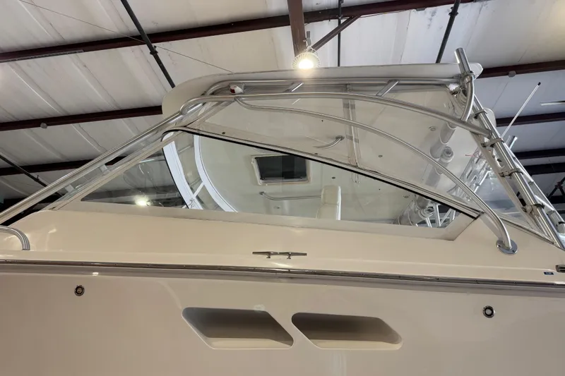 Slide: The Image of 2011 Luhrs 30 Open boat in a warehouse, showcasing sleek design and sturdy construction. - 9