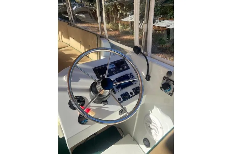 Slide: The Image of Steering wheel and dashboard of a 2007 Duffy 22' Cuddy Cabin boat. - 11