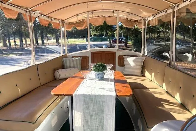 Slide: The Image of Interior of a 2007 Duffy 22' Cuddy Cabin boat with cozy seating and table. - 5
