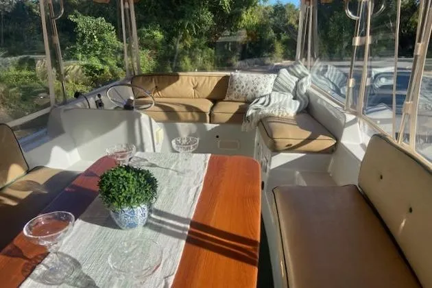 Slide: The Image of Interior of 2007 Duffy 22' Cuddy Cabin boat with seating and table. - 7