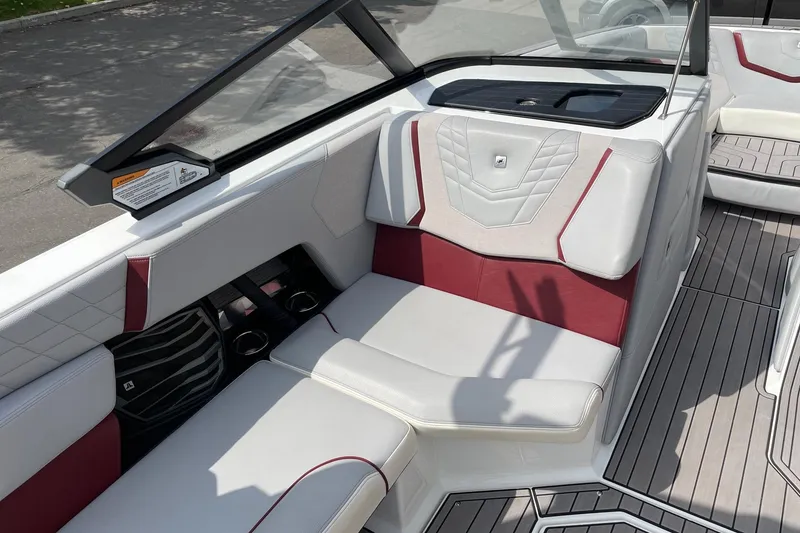 Slide: The Image of 2023 Nautique Super Air Nautique G23 interior with white and red seating. - 10