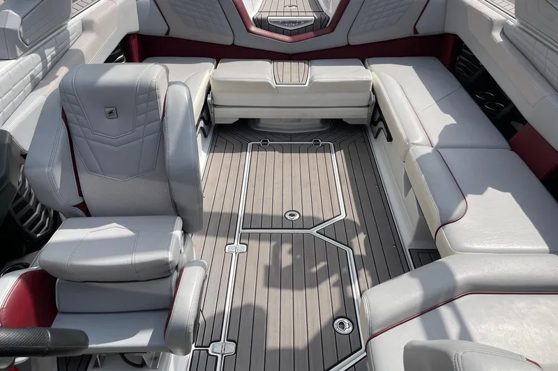 Slide: The Image of 2023 Nautique Super Air Nautique G23 interior with luxurious seating and sleek design. - 12