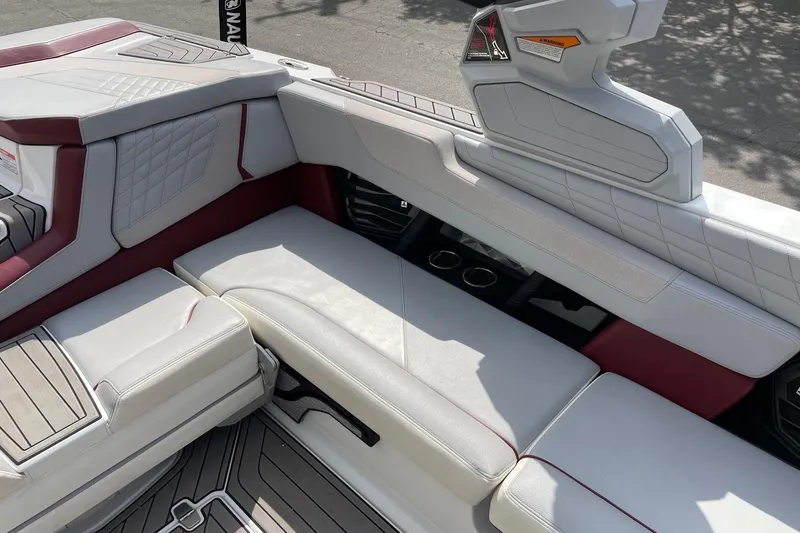 Slide: The Image of 2023 Nautique Super Air Nautique G23 interior seating with premium upholstery and cup holders. - 9
