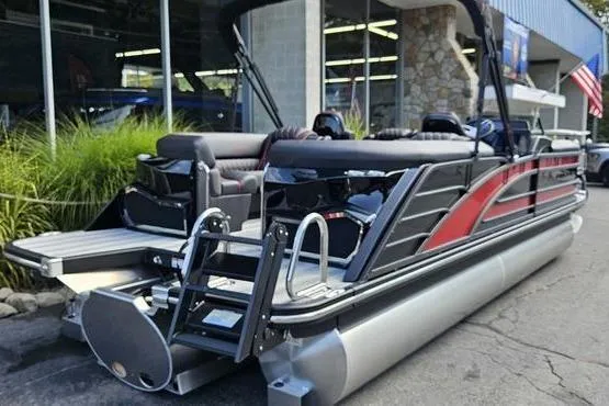 Slide: The Image of 2026 Bennington 23 RFB pontoon boat with sleek design and modern features, docked outdoors. - 11