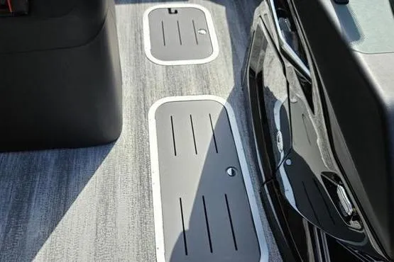 Slide: The Image of Interior flooring of 2026 Bennington 23 RFB boat with storage compartments. - 13