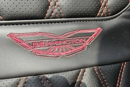 Slide: The Image of Bennington 23 RFB 2026 logo on black leather with red stitching. - 14