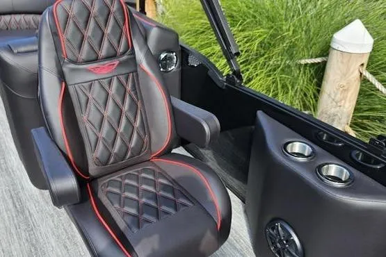 Slide: The Image of Luxurious seating on 2026 Bennington 23 RFB boat with diamond-stitched upholstery and cup holders. - 4