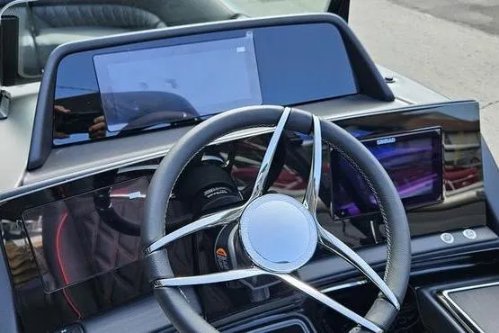 Slide: The Image of Steering wheel and dashboard of 2026 Bennington 23 RFB boat with digital displays. - 7