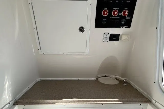 Slide: The Image of 2021 Tidewater 320 CC Adventure boat with Mercury engine, rear view. - 20