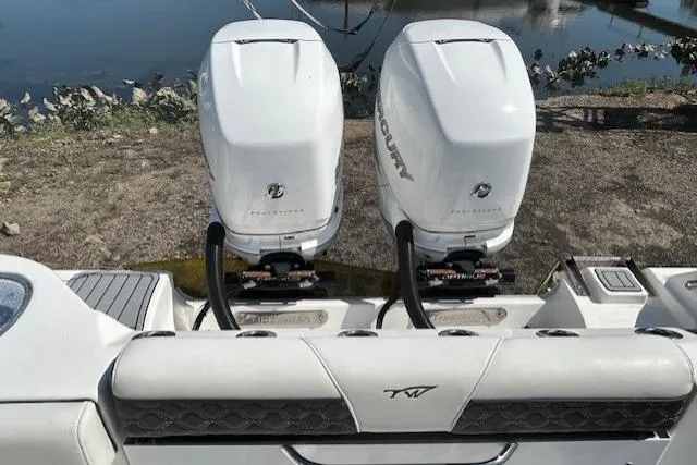 Slide: The Image of 2021 Tidewater 320 CC Adventure boat interior with toilet and seating area. - 22