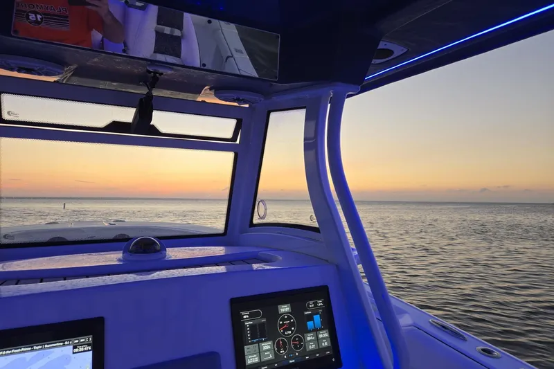 Slide: The Image of Interior of 2021 Tidewater 320 CC Adventure boat with control panel and countertop. - 28