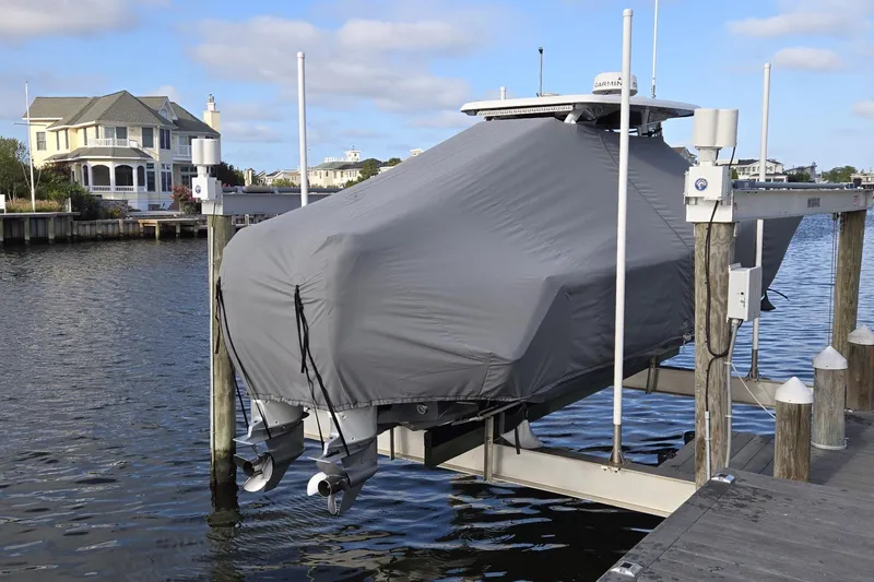 Slide: The Image of 2021 Tidewater 320 CC Adventure boat interior with seating and storage compartments. - 35