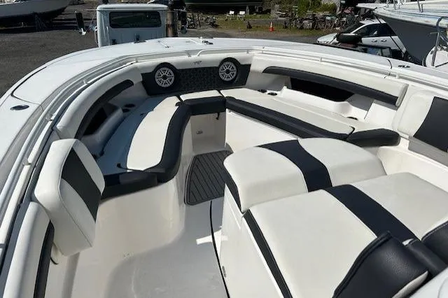 Slide: The Image of 2021 Tidewater 320 CC Adventure boat interior with dual seats and steering wheel. - 7