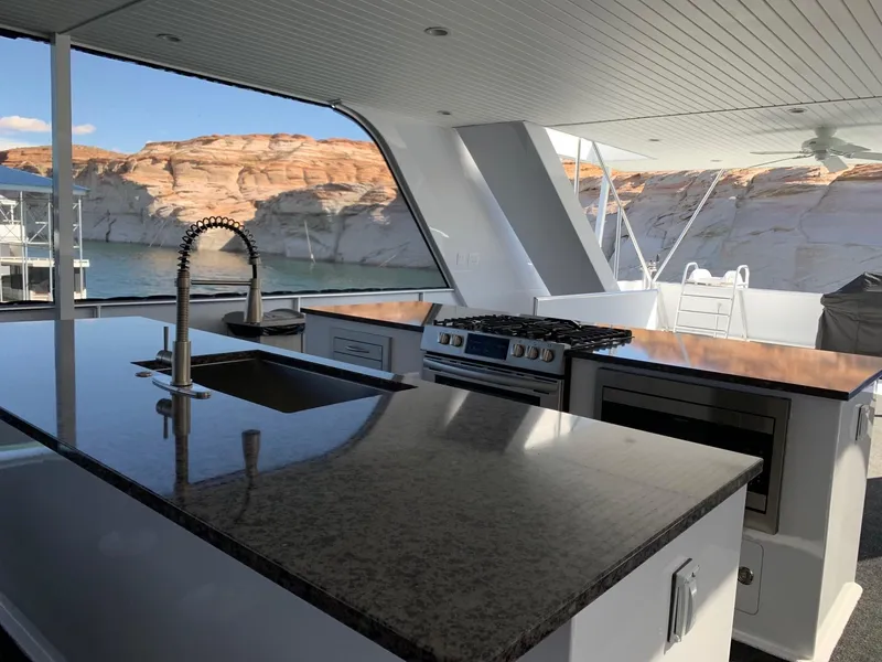 Slide: The Image of Luxurious kitchen on Adonia Harmony Share #4 houseboat, featuring modern appliances and scenic views. - 11