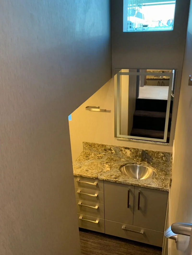 Slide: The Image of Modern bathroom with granite countertop and stainless steel sink in Adonia Harmony Share #4, 2020. - 5