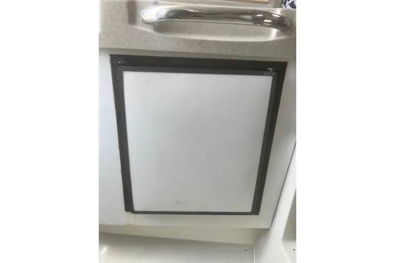 Slide: The Image of Cabinet door on 2000 Wellcraft 2900 Coastal WA boat interior. - 15