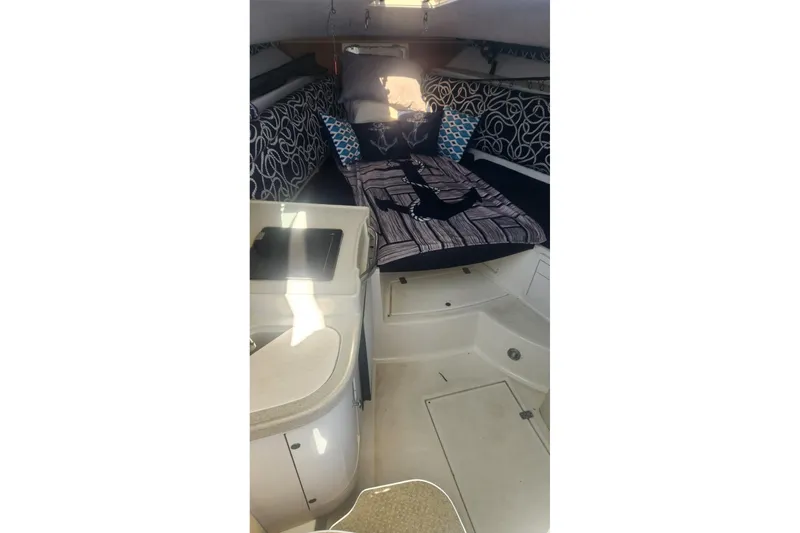 Slide: The Image of 2001 Wellcraft 2900 Coastal WA cabin interior with bed and kitchenette. - 18