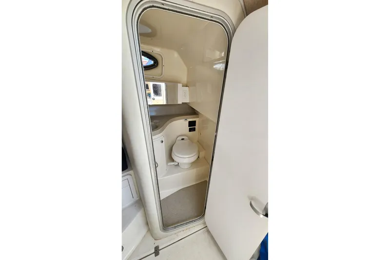 Slide: The Image of 2001 Wellcraft 2900 Coastal WA boat bathroom interior with toilet and sink. - 19