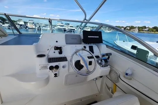 Slide: The Image of 2001 Wellcraft 2900 Coastal WA boat helm with steering wheel and navigation equipment. - 5