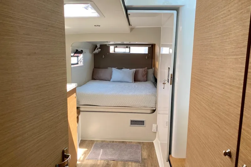 Slide: The Image of Cozy bedroom interior in 2021 Vision 444 yacht, featuring a comfortable bed and modern design. - 14