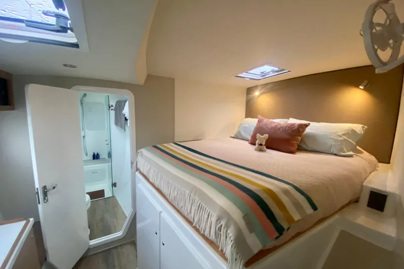 Slide: The Image of Cozy bedroom in 2021 Vision 444 yacht with ensuite bathroom and skylight. - 15