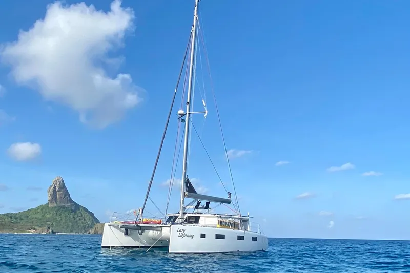 Slide: The Image of Sailing catamaran "Lazy Lightning" on ocean near island, Vision 444 model, 2021. - 3