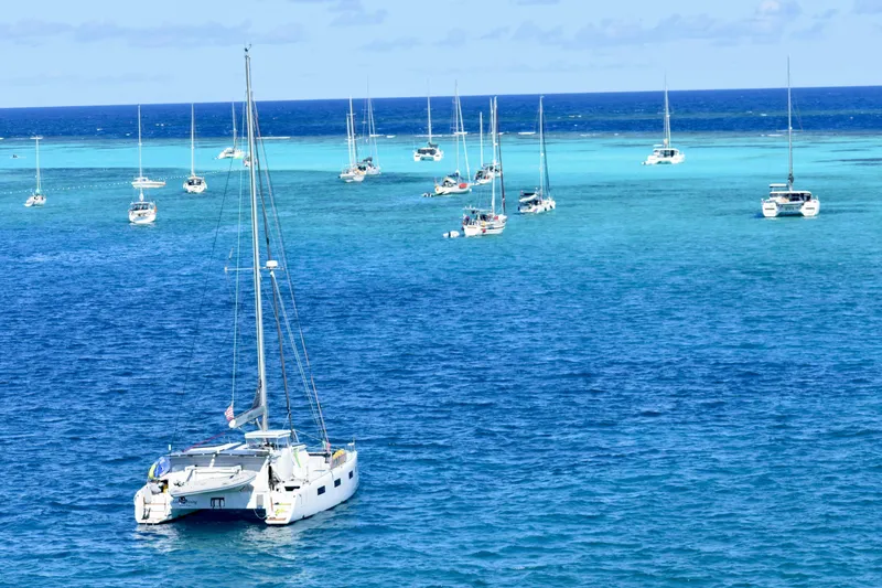 Slide: The Image of Sailboats anchored in clear blue ocean waters, Vision 444 model, 2021. - 5