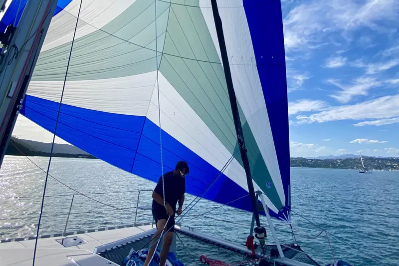 Slide: The Image of Sailboat with colorful sail on calm water, Vision 444 model, 2021. - 7