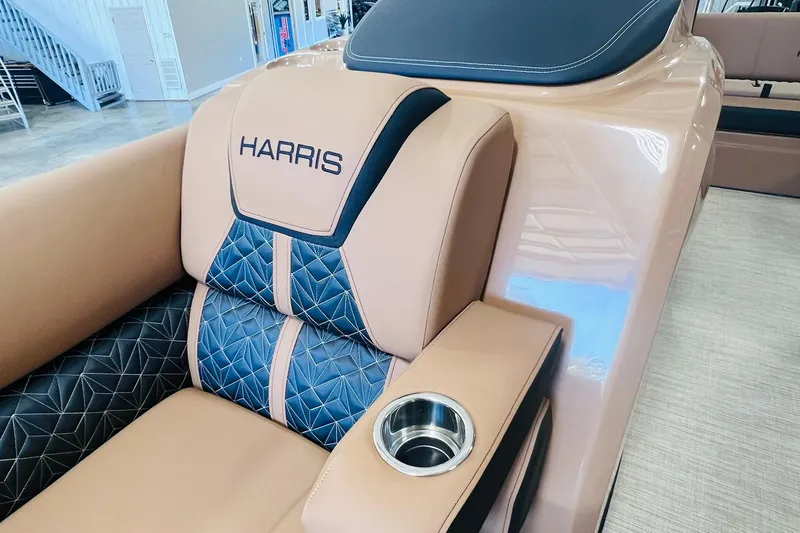 Slide: The Image of Luxurious seating on 2025 Harris 250 Grand Mariner V10 400 boat, featuring elegant design and cup holder. - 10