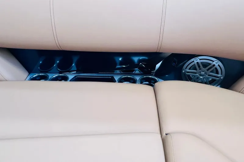 Slide: The Image of Luxurious interior of 2025 Harris 250 Grand Mariner V10 400 with beige seating and speaker system. - 14