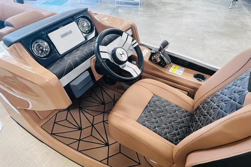 Slide: The Image of 2025 Harris 250 Grand Mariner V10 400 boat interior with luxury steering and dashboard. - 17