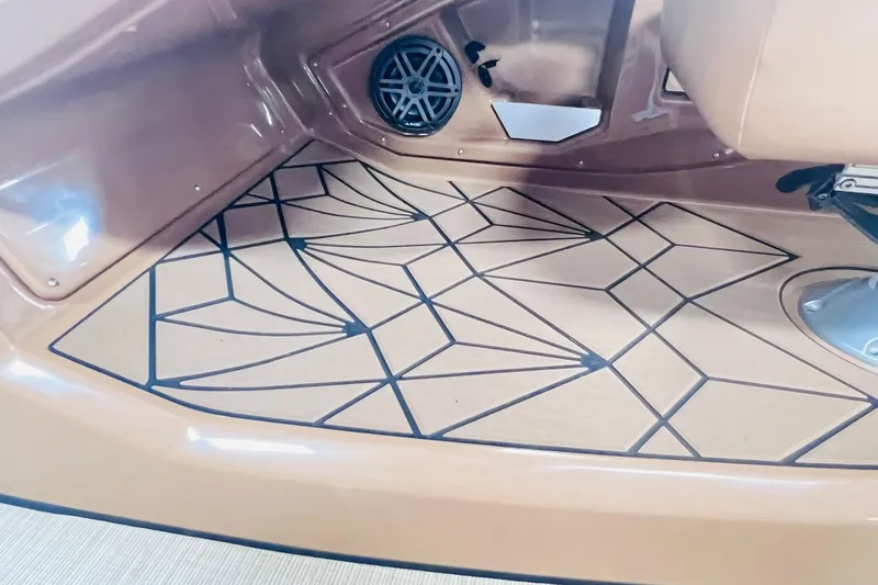 Slide: The Image of 2025 Harris 250 Grand Mariner V10 400 boat interior with geometric floor design. - 19