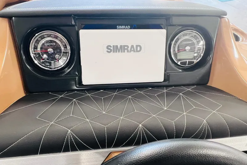 Slide: The Image of Dashboard of 2025 Harris 250 Grand Mariner V10 400 with Simrad display and gauges. - 21