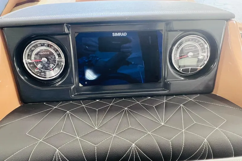 Slide: The Image of Dashboard of 2025 Harris 250 Grand Mariner V10 400 with Simrad display and gauges. - 22