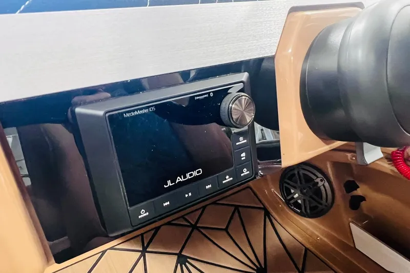 Slide: The Image of JL Audio MediaMaster display in 2025 Harris 250 Grand Mariner V10 400 boat dashboard. - 23